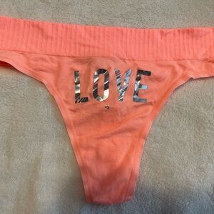 Orange with shiny silver Love VS thong, NWT